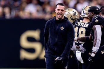 New Orleans Saints quarterback Derek Carr walks down sideline.