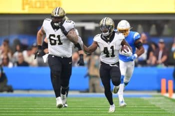 New Orleans Saints running back Alvin Kamara runs the ball.