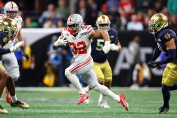 Ohio State Buckeyes running back TreVeyon Henderson runs the ball.
