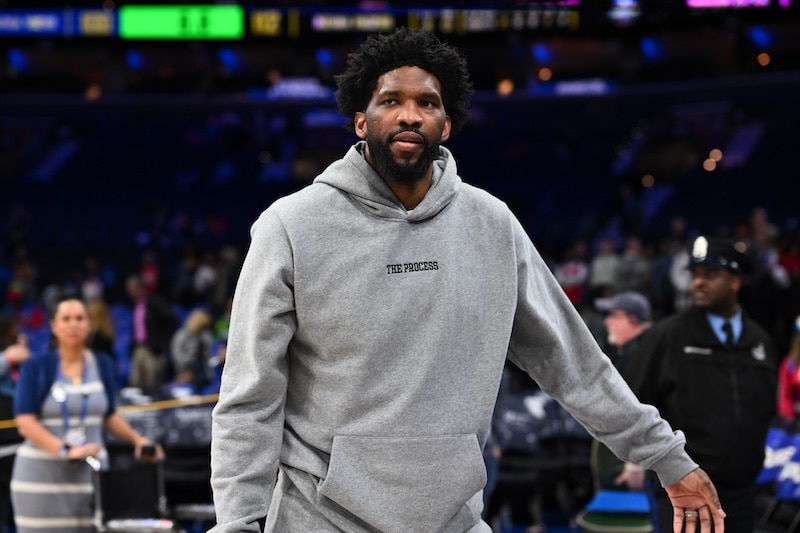Joel Embiid walks on the court.