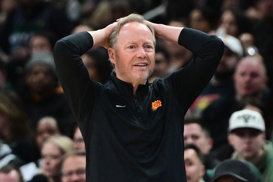 Phoenix Suns head coach Mike Budenholzer puts his hands over his head.