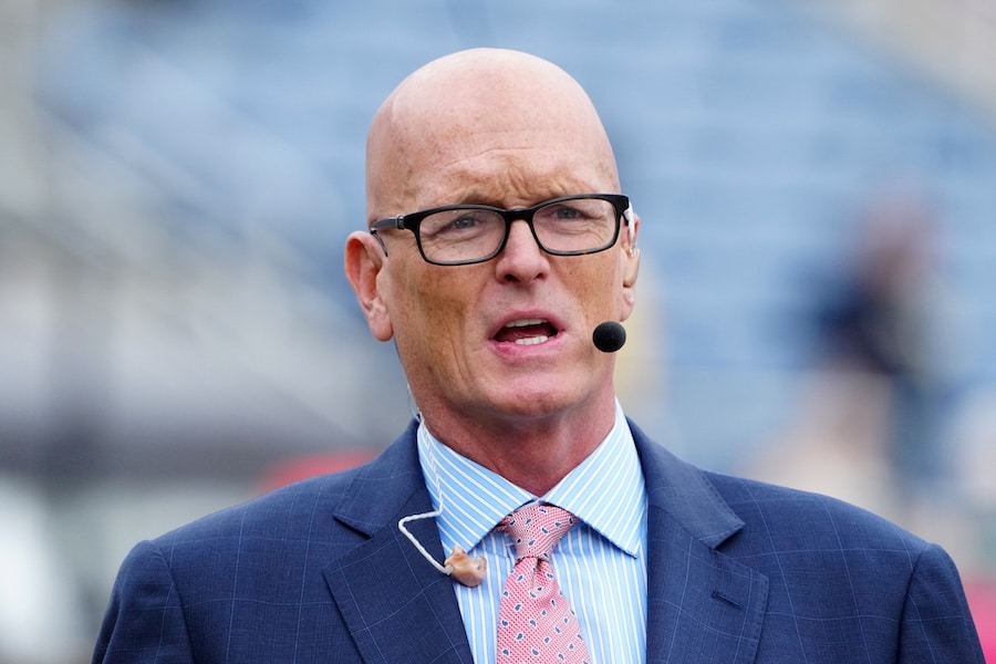 Scott Van Pelt looks on.