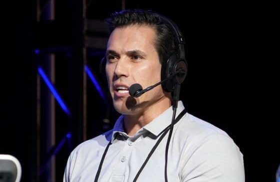 Brady Quinn with a mic to his face.