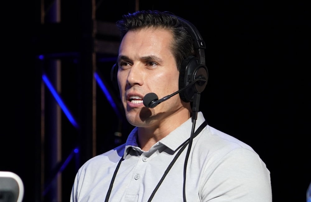 Brady Quinn with a mic to his face.