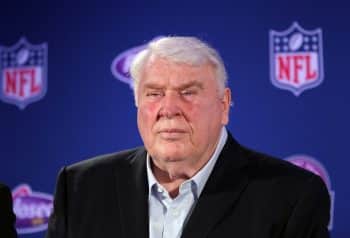 John Madden stands and stares.