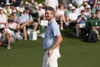 Justin Rose stands on the green at Augusta.