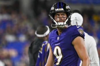 Baltimore Ravens kicker Justin Tucker looks up.