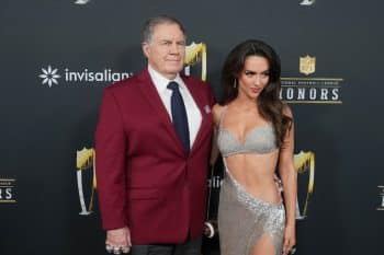 Bill Belichick and Jordon Hudson pose.