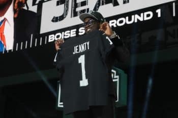 Boise State Broncos running back Ashton Jeanty holds his jersey up.