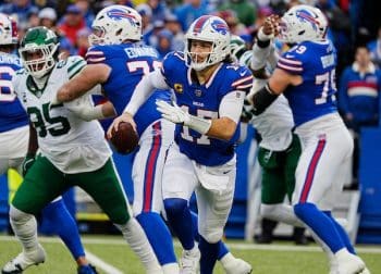 Buffalo Bills quarterback Josh Allen runs with the ball.