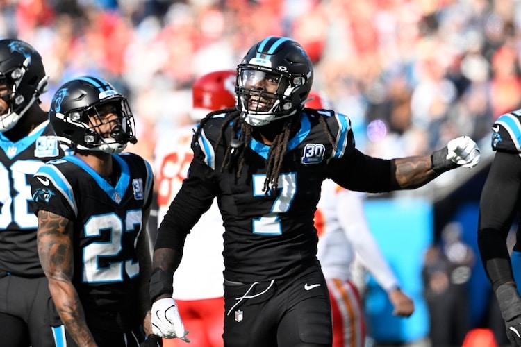 Carolina Panthers linebacker Jadeveon Clowney stands on the field.