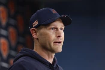 Chicago Bears head coach Ben Johnson stands at the podium.