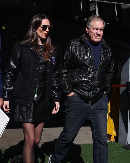 Jordon Hudson and Bill bElichick walking next to each other.