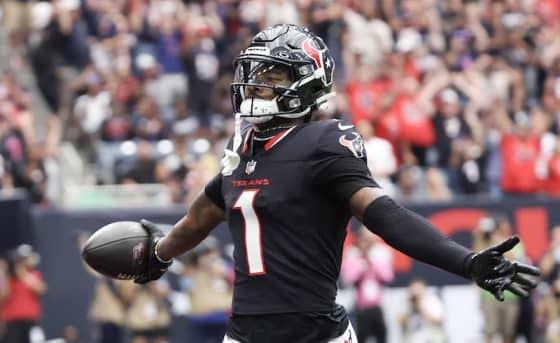 Stefon Diggs puts his arms up for the Texans.