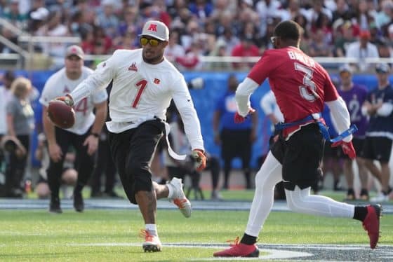 Ja'Marr Chase runs the ball on the field.