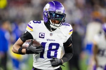 Minnesota Vikings wide receiver Justin Jefferson holds the ball.