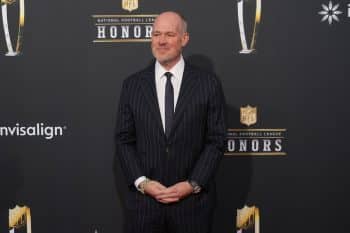 Rich Eisen on the red carpet before the NFL Honors holds his hands.