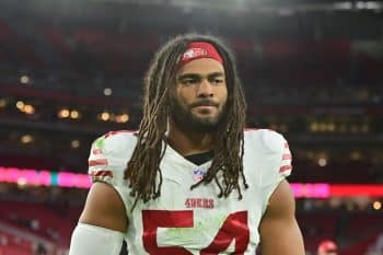 San Francisco 49ers linebacker Fred Warner stands on the field.