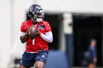Tennessee Titans quarterback Cam Ward holds the ball.