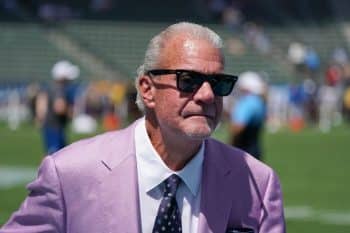 Colts owner Jim Irsay stands on the field.