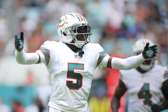 Jalen Ramsey puts his arms up on the field.