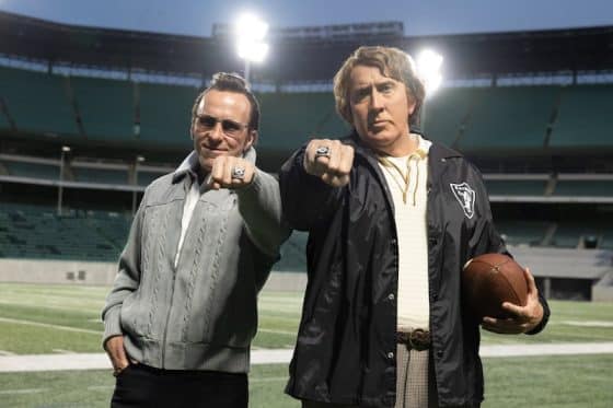 Two men point their rings in Madden.