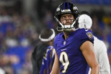 Baltimore Ravens kicker Justin Tucker stares on the field.