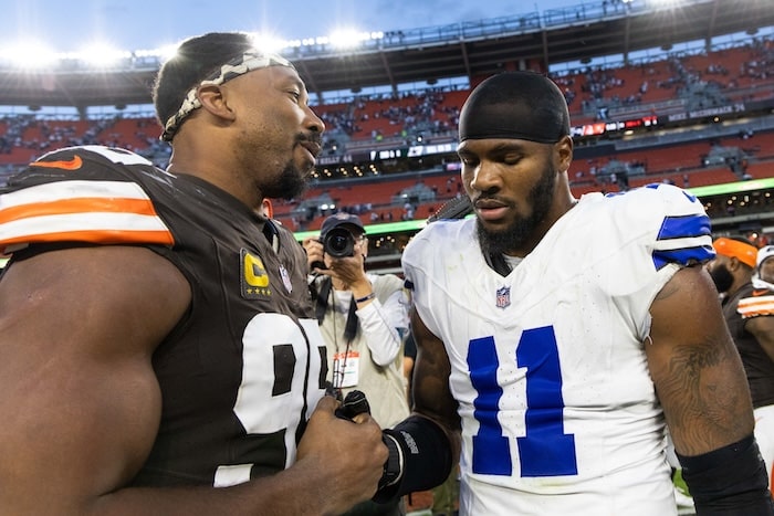 Myles Garrett claps hands with Micah Parsons.