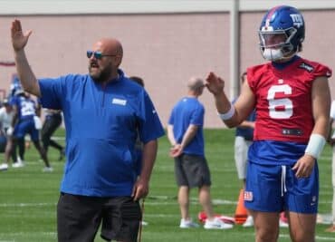 Jaxson Dart stands next to Brian Daboll.