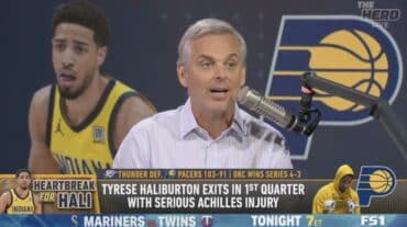 Colin Cowherd talks on the mic.