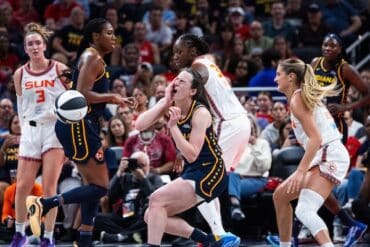 Connecticut Sun guard Jacy Sheldon and Fever guard Caitlin Clark.