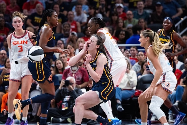 Connecticut Sun guard Jacy Sheldon and Fever guard Caitlin Clark.