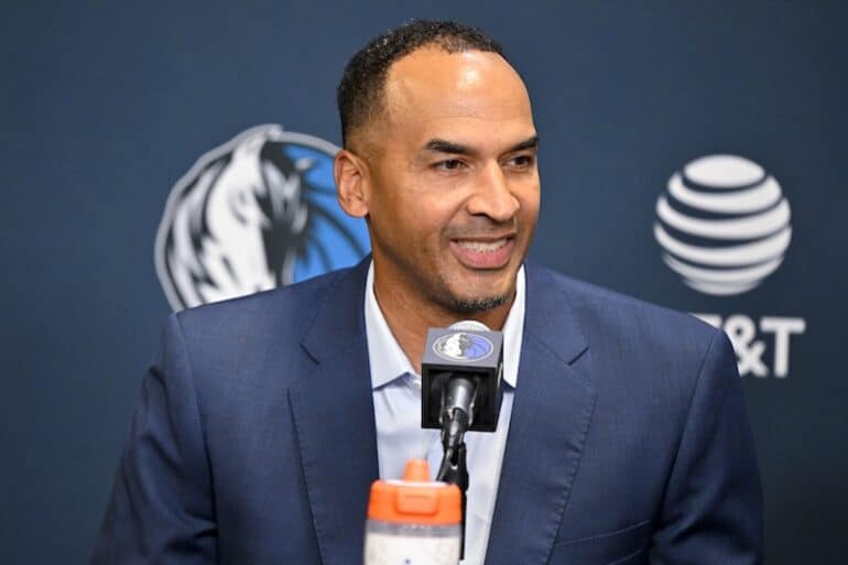 Nico Harrison sits in front of a mic.