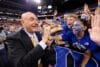 Dick Vitale goes for high fives.