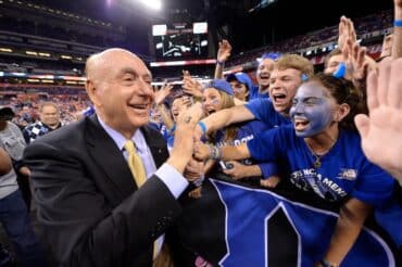 Dick Vitale goes for high fives.