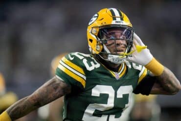 Jaire Alexander puts his hand up to ear.