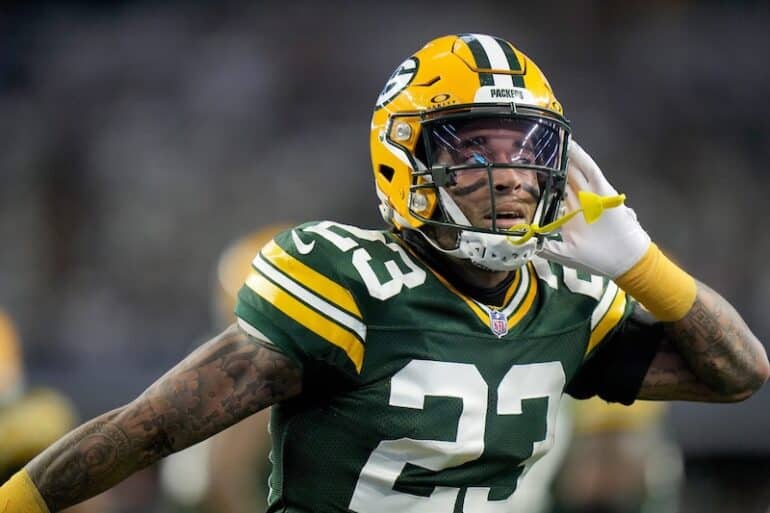 Jaire Alexander puts his hand up to ear.