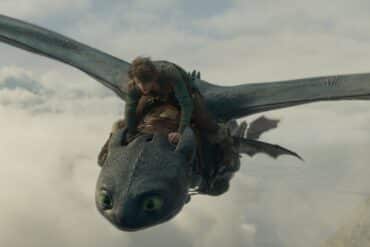 A boy rides a creature in How to Train Your Dragon.