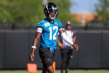 Travis Hunter walks on the field.