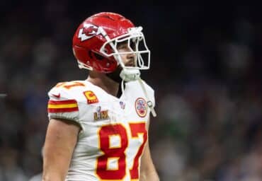 Travis Kelce walks off the field.