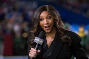 Maria Taylor holds up her mic.