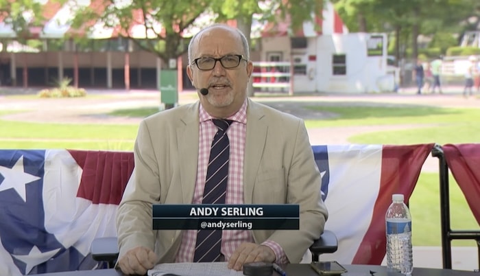 Andy Serling sits t the desk.