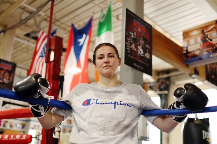 Katie Taylor stands up against the ropes.