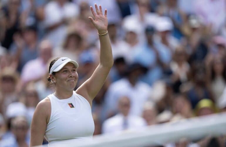 Amanda Anisimove waves to the crowd.