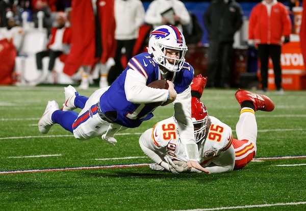 Buffalo Bills quarterback Josh Allen dives with the ball.