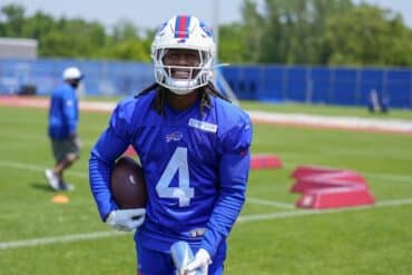 Buffalo Bills running back James Cook holds the ball.