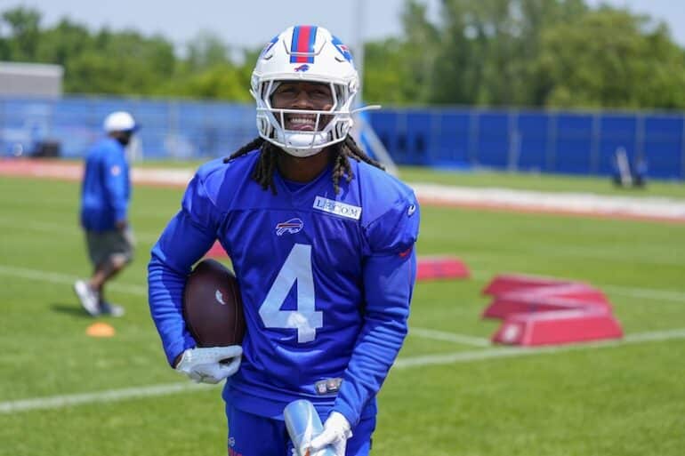 Buffalo Bills running back James Cook holds the ball.