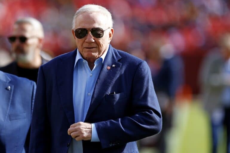 Jerry Jones stands on the field.