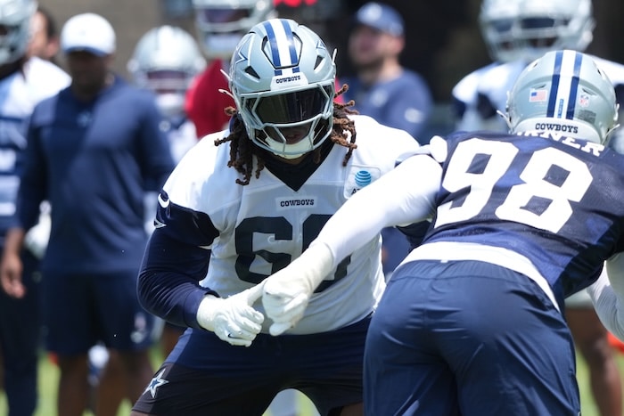 Dallas Cowboys tackle Tyler Guyton stands up.