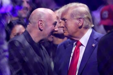Dana White and Donald Trump look at each other.